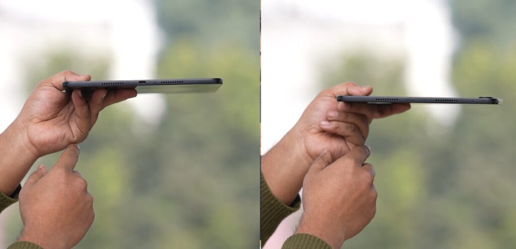 Person holding a tablet sideways.