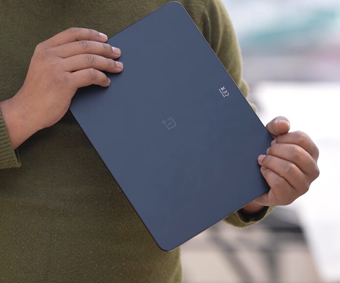 Person holding a tablet device.