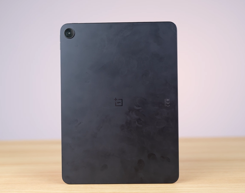 Black tablet on wooden surface